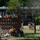 Investigators search for evidence outside Robb Elementary School in Uvalde, Texas, May 25, 2022, after an 18-year-old gunman killed 19 students and two teachers.